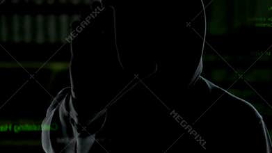 Male person in hood making stop sign, stop piracy and hacker attacks on Internet