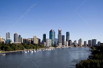 Yachts in front of city skyline
