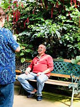 A butterfly landing on a man`s nose
