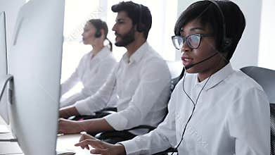 People Work At Contact Center. Woman In Headset Working