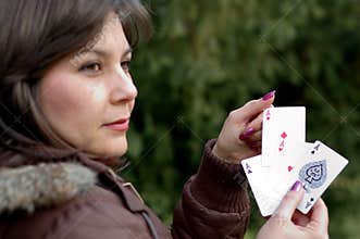 Woman holding playing cards