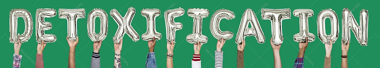 Hands holding detoxification word in balloon letters