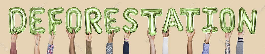 Hands holding deforestation word in balloon letters