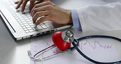 Cardiology - doctor cardiologist working on laptop computer in office