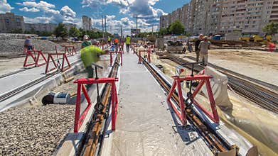 Tram rails at the stage of their installation and integration into concrete plates on the road timelapse hyperlapse.