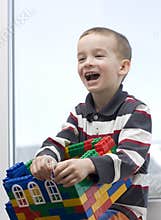 A boy and a toy house.