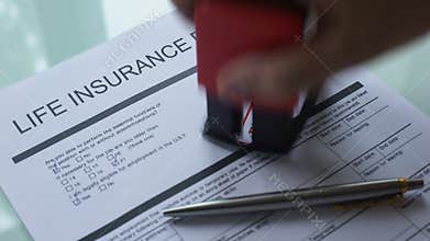 Rejected document of life insurance policy, hand stamping seal on official paper