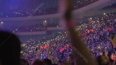 Large audience inside an arena hip-hop concert