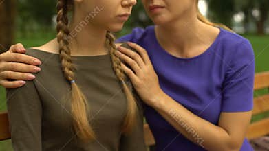 Upset girl needs mothers advice and support, problems in school, bullying