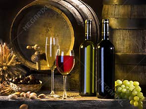 The still life with red wine and barrels
