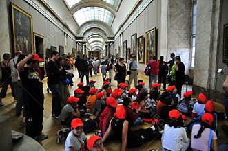 School children with red beanies at the Louvre
