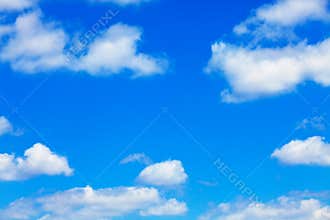 Blue sky with white fluffy clouds