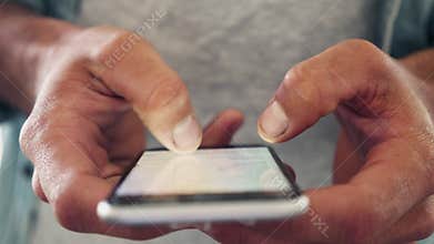 Midsection Of Freelancer Using Cellphone In cafe