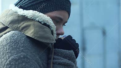 Poor woman in dirty clothes feeling cold, homeless lifestyle, hopelessness