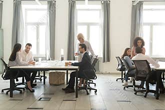 Modern office interior with business team people working on computers