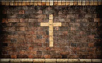 Christian cross in brick wall