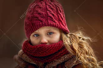 Sad little girl portrait with accent on eyes with tear