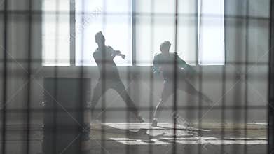 Two friends dance synchronously hip hop modern in an abandoned building. Contemporary. Hip hop culture. Rehearsal.