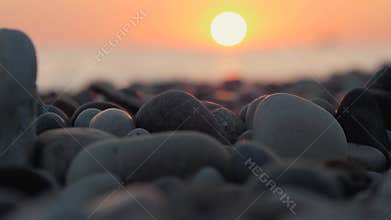 People bathe in the sea in the sun, bathe and play games on the beach. Tourists on the beach from the pebbles of the sea