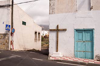 House with a wooden cross