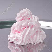 Whipped cream on a metal plate