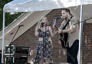 Folk duet performing on Acoustic Music Festival in Florida.