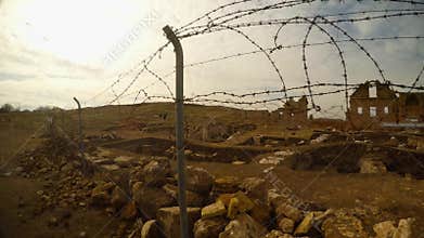 Barbed wire, remains of the minaret, ruins of Date Harran University East of Turkey, border with Syria