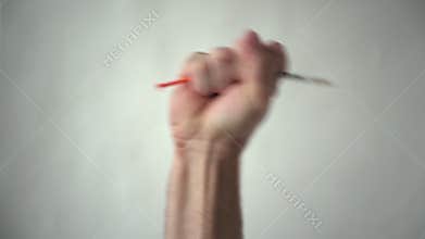 The man`s hand holds, and then throws out the syringe. Victory over a disease or drug addiction