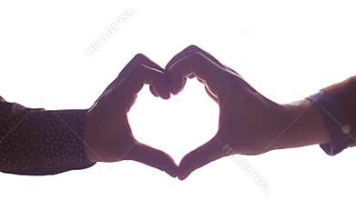 Close up of male gay couple making hand heart