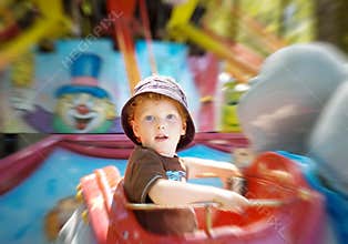 Kid on fun fair ride