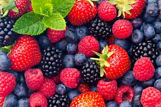 Wild berries strawberries, blueberries, blackberries, raspberries - Closeup photo