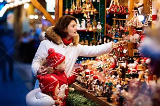 Family at Christmas market. Xmas winter fair.