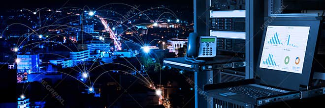 Management and monitoring monitor in data center and connectivity lines over night city background