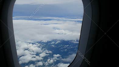 4K. airplane window view fly over cloud. passenger aircraft aviation airline flying. traveling business. transportation by air
