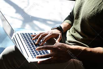 PR manager browsing new summaries on laptop