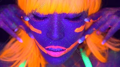 woman with UV fluorescent face and body makeup