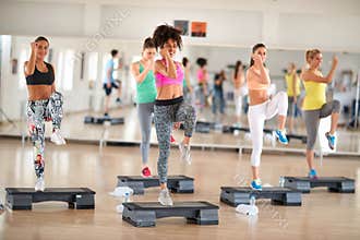 Fitness group training on stepper