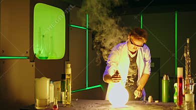 Young chemist making experiments in laboratory