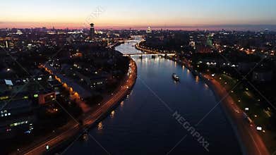 The big city and the river at sunset in the summer