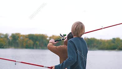 Father and son are fishing