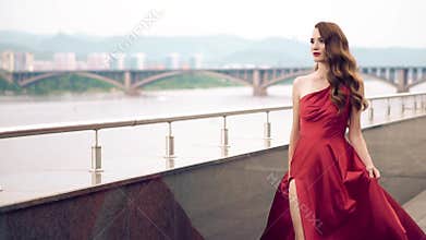 Beautiful woman in red fluttering dress.