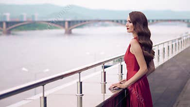 Beautiful woman in red fluttering dress.
