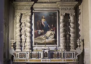 Side Altar of the Duomo Cathedral featuring a painting with Mary mourning over the dead Jesus in Lecce, Italy