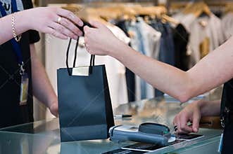 Passing the shopping bag