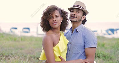 Woman with boyfriend pointing away