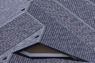 Rooftop in a newly constructed subdivision in Kelowna British Columbia Canada showing asphalt shingles