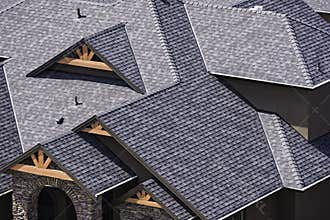Rooftop in a newly constructed subdivision in Kelowna British Columbia Canada showing asphalt shingles