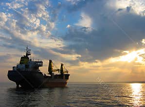 Dry Cargo Ship At Sunset