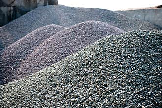 Gravel gray stone textures asphalt mix concrete in road construction. Pile rock and stone for Industrial