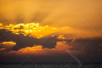 Sunrise or sunset at sea. Ocean sky background image.
